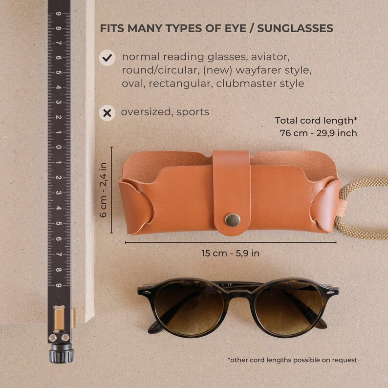 May include: A brown leather glasses case with a snap closure and a cord for carrying. The case measures 6 cm by 15 cm. The text on the image reads "Fits many types of eye/sunglasses" and lists the types of glasses the case fits. The text also says "Total cord length* 76 cm - 29.9 inch" and "*other cord lengths possible on request".