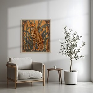 May include: A framed illustration of a cheetah sitting in a jungle setting. The cheetah is orange and black with a white background. The frame is a light brown wood.