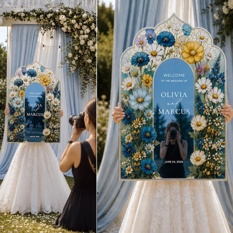 May include: An arched wedding welcome sign featuring a blue center panel with the text Welcome to the wedding of Olivia and Marcus June 24, 2026. The frame is decorated with a vibrant floral arrangement of blue, yellow, and white flowers.
