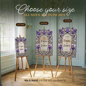 May include: Three arched wedding signs on wooden easels featuring a stained glass iris flower design in purple and gold. The signs display the text Emma & James and are available in sizes 24x16 inches, 36x24 inches, and 42x28 inches as labeled.