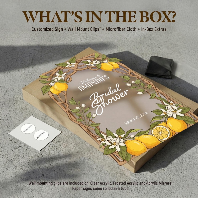 May include: A box with a custom sign for a bridal shower, decorated with lemons and flowers. The sign reads "Welcome to Amanda's Bridal Shower" with the date March 25, 2026. Includes wall mount clips and a microfiber cloth.