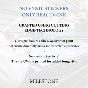 May include: A white informational sign featuring black and blue text that reads: NO VYNIL STICKERS ONLY REAL UV-INK, CRAFTED USING CUTTING EDGE-TECHNOLOGY, Our signs feature a thick, waterproof paint that ensure durability and a sophisticated appearance, No vynil stickers here! They're UV-ink printed for added longevity, MILESTONE.