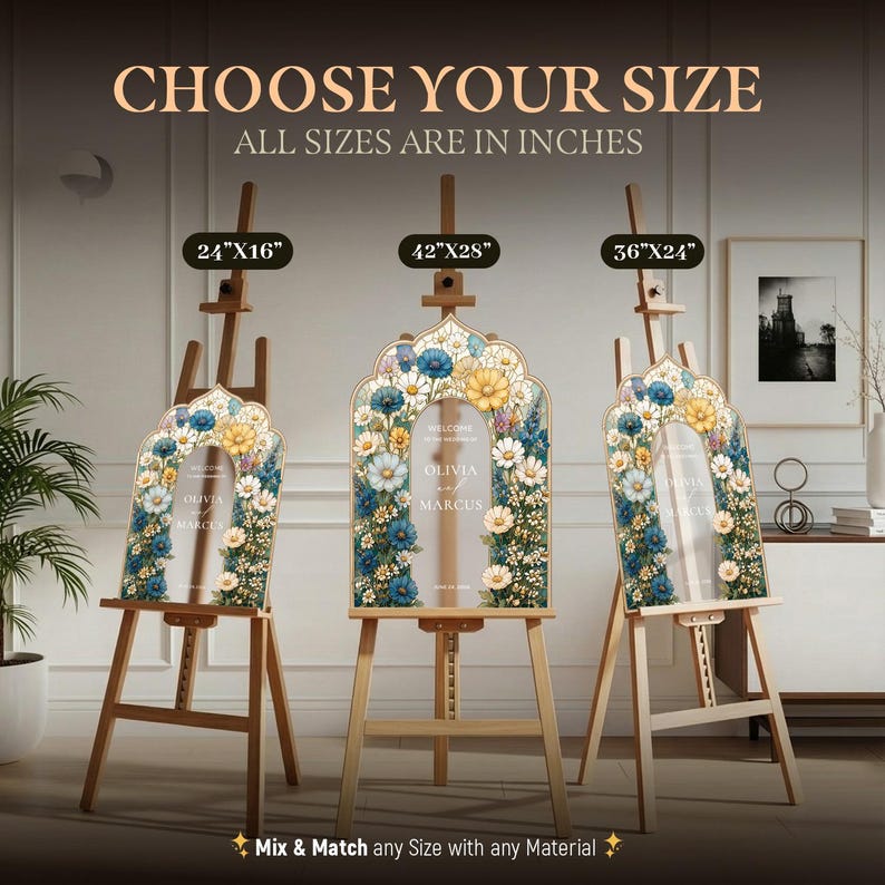 May include: Three arched wedding signs on wooden easels, featuring floral borders with blue and yellow flowers. Text reads: CHOOSE YOUR SIZE, ALL SIZES ARE IN INCHES, 24"X16", 42"X28", 36"X24", WELCOME OLIVIA AND MARCUS, and Mix & Match any Size with any Material.