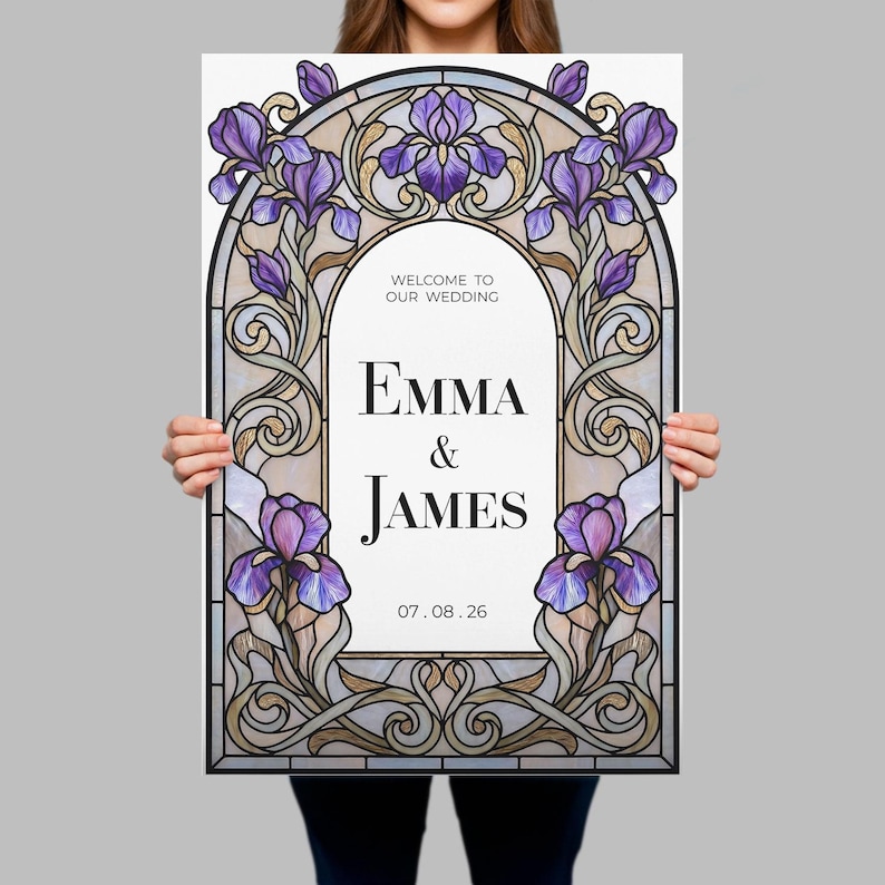May include: A rectangular wedding welcome sign featuring a stained glass style border with purple iris flowers and swirling gold lines. The center white panel displays the text: WELCOME TO OUR WEDDING, EMMA & JAMES, and the date 07.08.26.