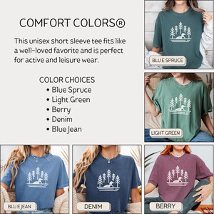 A Comfort Colors® unisex short sleeve T-shirt size and color guide featuring a minimalist loon and pine tree design. The image showcases five available colors: Blue Spruce, Light Green, Berry, Denim, and Blue Jean. Each T-shirt is styled in a casual, relaxed fit, perfect for both active and leisure wear. The layout includes a neutral background with labeled images of each color option for easy selection.