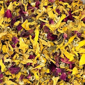 May include: A mixture of dried flower petals in shades of yellow, orange, and pink. The petals are loose and scattered, creating a colourful and fragrant display.