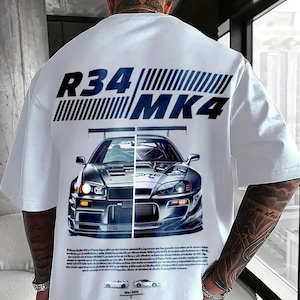May include: White t-shirt featuring a split image of a silver sports car with the text "R34 MK4" above. The design includes additional text and two small car illustrations at the bottom, with the text "90/2000".