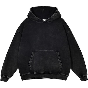 May include: A black hoodie with a washed, vintage appearance. The sweatshirt has a hood, a kangaroo pocket, and ribbed cuffs and hem. The fabric has a slightly faded look, giving it a worn aesthetic. The hoodie is a casual, comfortable garment.