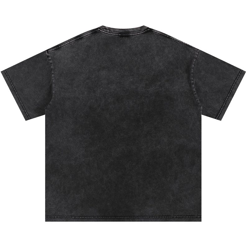 May include: A charcoal-coloured, short-sleeved t-shirt with a vintage, acid-wash effect. The shirt has a crew neck and a relaxed fit, ideal for casual wear. The fabric appears soft and slightly faded, giving it a worn-in look.