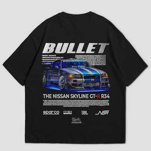 May include: Black t-shirt with a graphic of a blue and silver Nissan Skyline GT-R R34 car with blue racing stripes. The word "BULLET" is printed above the car, with additional text and logos below.
