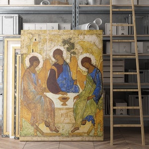May include: A vintage religious icon painting depicting three figures with halos, likely representing the Holy Trinity. The figures are seated around a table with a chalice, and the background is a golden yellow with a hint of green.