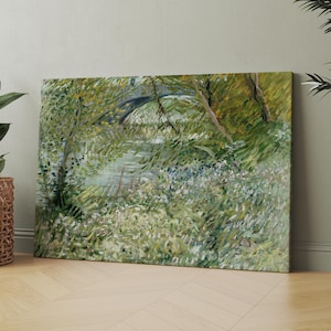 May include: Canvas print of a landscape painting featuring a stone bridge over a river. The artwork depicts lush greenery, including trees and foliage, with a palette of greens, yellows, and blues. The style is reminiscent of impressionist art.