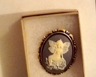 SEATED Cream colored Flower FAIRY CAMEO set in Goldtone Country Blue colored background with Rhinestone