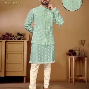 May include: A light green kurta with a matching waistcoat, both featuring a white floral pattern. The kurta has a mandarin collar and long sleeves. The waistcoat has a button closure. The model is wearing white pants and brown shoes. The text "D.no-5001" is visible in the bottom left corner of the image.