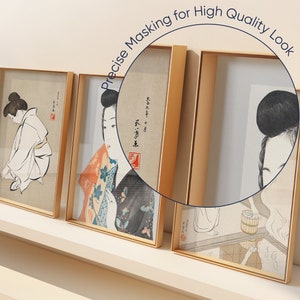 May include: Three framed prints of Japanese woodblock prints depicting women in traditional clothing. The prints are in gold frames and are displayed on a white shelf.