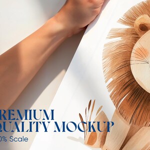 May include: A watercolor illustration of a smiling lion with a brown mane and a light brown face. The image includes the text "PREMIUM QUALITY MOCKUP" and "150% Scale" in blue. The lion is set against a white background.