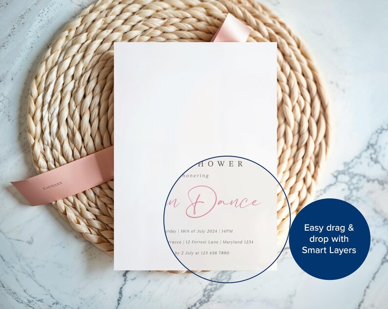 May include: A white invitation card with the text "Shower Honoring + Dance" in pink script, tied with a pink ribbon, rests on a woven placemat. The card includes event details. The background is a marble surface.