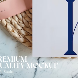 May include: A mockup featuring a white surface with a large blue letter, a pink card with text, and a woven texture. The text "PREMIUM QUALITY MOCKUP" and "150% Scale" are also visible.