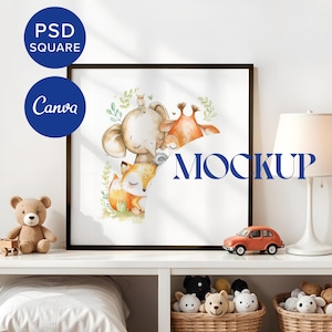 May include: A framed watercolor illustration of a fox, elephant, and giraffe in a forest setting. The frame is black and the illustration is on a white background. The image is displayed on a white shelf with a lamp and other decor.