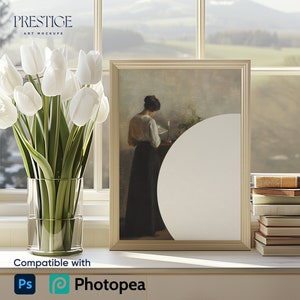 May include: A white framed picture with a painting of a woman in a dark dress sitting at a table. The picture is on a white shelf with a vase of white tulips and a stack of books.