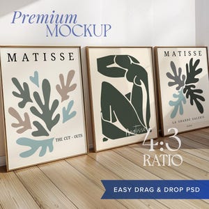 Può includere: Tre stampe d'arte incorniciate con un rapporto di 4:3. Le stampe presentano disegni astratti in tonalità di verde, blu e marrone. Le stampe sono intitolate "Matisse" e includono il testo "The Cut-Outs" e "La Grande Galerie".