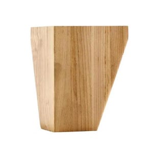 May include: A solid, light-colored wooden furniture leg with a unique, angled design. The leg is made of natural wood, showcasing the grain and texture. The shape is a trapezoid with one side cut at an angle.