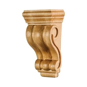 May include: A wooden corbel with a light brown finish. The corbel features a decorative scroll design and a layered top and bottom. The wood grain is visible, adding texture to the architectural element. This decorative bracket is designed for interior use.