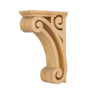 May include: A light-colored wooden corbel with a scroll design. The corbel has a rectangular top and a curved, decorative support with a scroll at the bottom. The wood grain is visible.