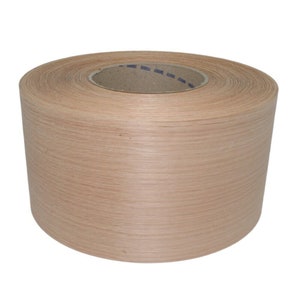 May include: A roll of natural wood veneer tape. The tape is wound around a cardboard core and has a light brown color.