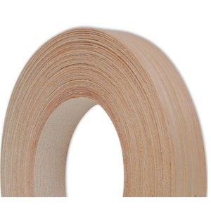 May include: A roll of natural wood veneer tape. The tape is wound tightly and has a light brown color.