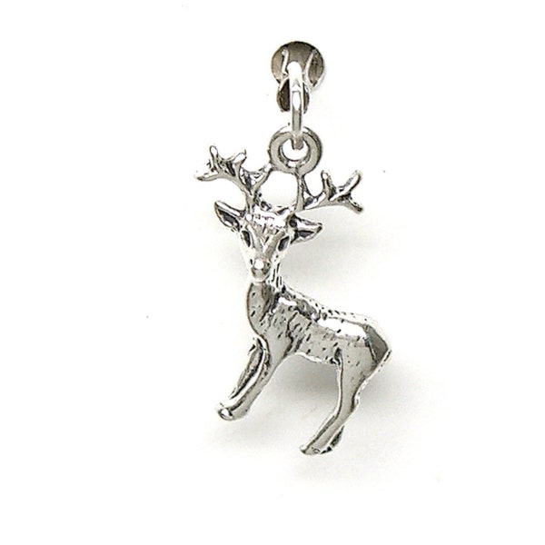May include: A silver charm in the shape of a deer with antlers. The charm is attached to a silver loop.