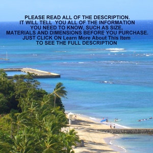 May include: A scenic view of a beach with palm trees, a pier, and turquoise water. The beach is sandy and there are people swimming and surfing in the water.