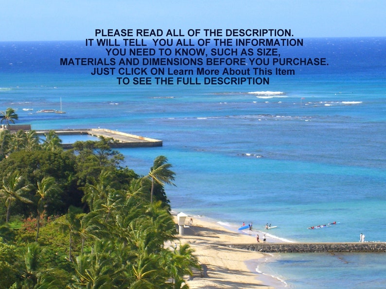 May include: A scenic view of a beach with palm trees, a pier, and turquoise water. The beach is sandy and there are people swimming and surfing in the water.