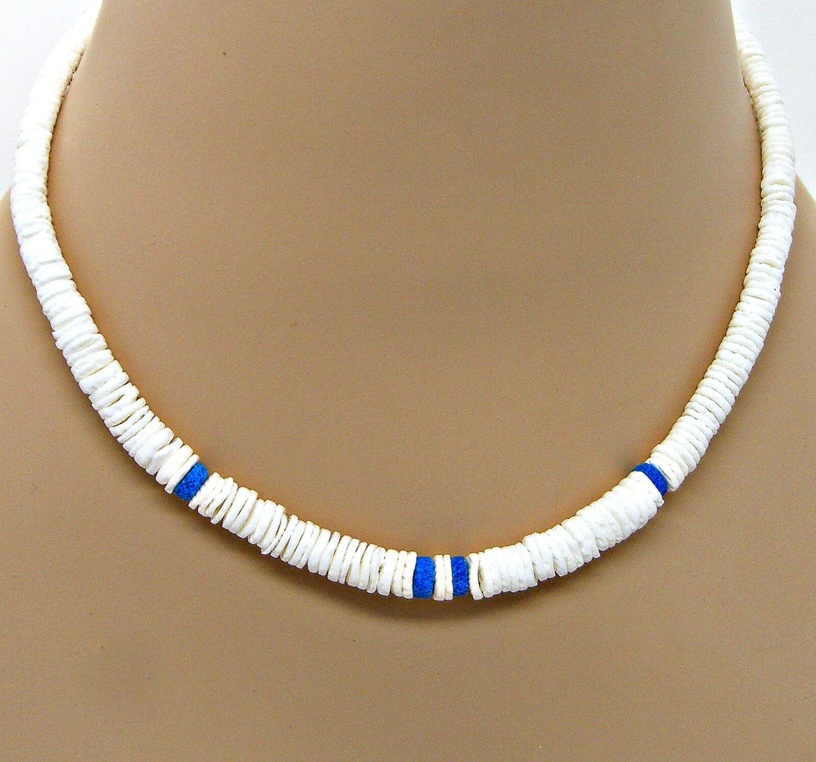 Graduated Puka Shell Necklace 18-inches. Add a Fossil Shark Tooth