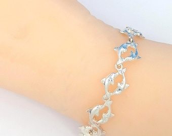 Linked Dolphins Charm Bracelet: Sterling Silver, Beach 7 inches SSB-D1