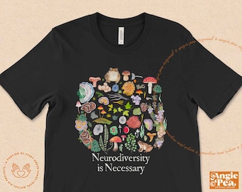 May include: Black t-shirt with a white graphic of a mushroom and toad surrounded by other mushrooms, leaves, and flowers. The text "Neurodiversity is Necessary" is printed in white below the graphic.