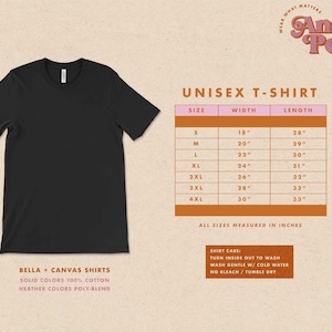 May include: Unisex t-shirt size chart with measurements in inches. The chart shows sizes S through 4XL with corresponding width and length measurements. The chart is on a pink background with a brown border.