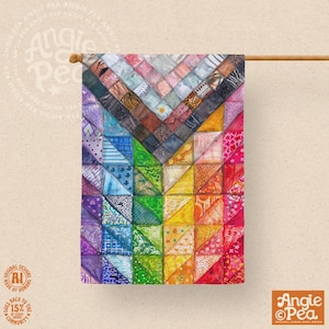 May include: A rectangular garden flag featuring a vibrant patchwork design of triangular segments in a rainbow spectrum. The pattern includes various textures, floral motifs, and geometric prints arranged in a chevron-like layout on fabric.