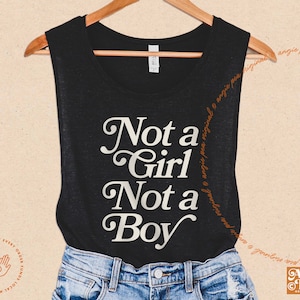 May include: A black tank top with the text "Not a Girl Not a Boy" in a white retro font.