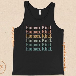 May include: Black tank top with the text "Human. Kind." repeated six times in rainbow colors.