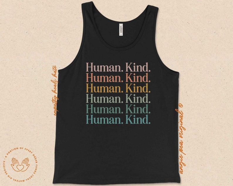 May include: Black tank top with the text "Human. Kind." repeated six times in rainbow colors.