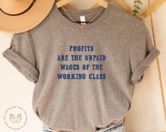 May include: A gray t-shirt with the text "Profits are the unpaid wages of the working class" printed in blue.