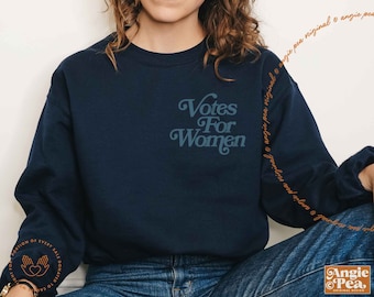 May include: A navy blue sweatshirt with the text "Votes For Women" in a retro font.