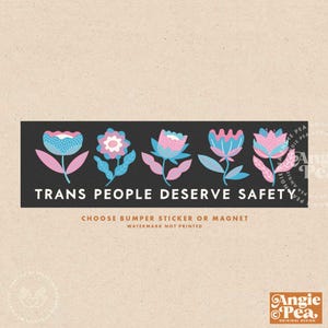 May include: A black and white bumper sticker with a row of stylized flowers in pink and blue. The text "TRANS PEOPLE DESERVE SAFETY" is printed in white on a black background. The sticker is available as a bumper sticker or magnet.