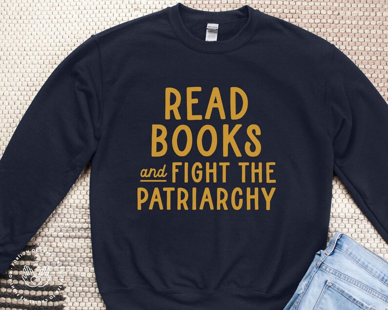 May include: A navy blue sweatshirt with the text "Read Books and Fight the Patriarchy" in yellow.