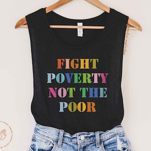 May include: A black tank top with the text "FIGHT POVERTY NOT THE POOR" in rainbow colors.