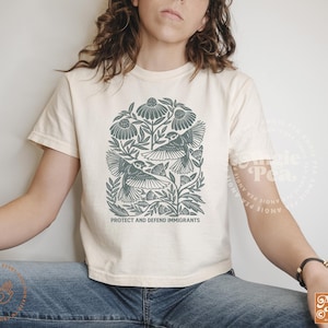 Protect and Defend Immigrants, Immigrants make America Great, No One is Illegal on Stolen Land, Migration is a Human Right,