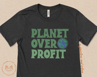 May include: A dark gray t-shirt with the text "PLANET OVER PROFIT" in green letters. A small image of the Earth is between the words "OVER" and "PROFIT".