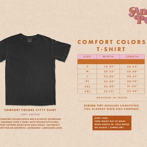 May include: A black, 100% cotton t-shirt with a slightly distressed, garment-dyed look. The shirt has double stitching and a relaxed, oversized fit. The size chart shows measurements in inches for sizes S through 3XL.
