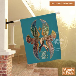 May include: A teal blue garden flag with a colorful illustration of two geese intertwined with the text "Take care of each other".